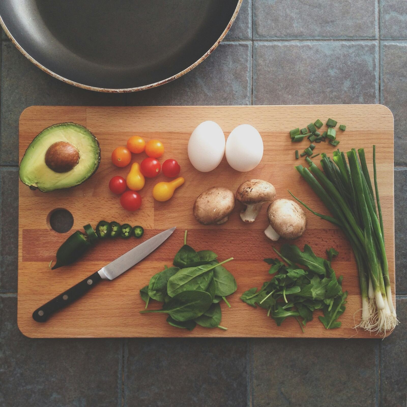A kitchen table set with fresh ingredients and morning light